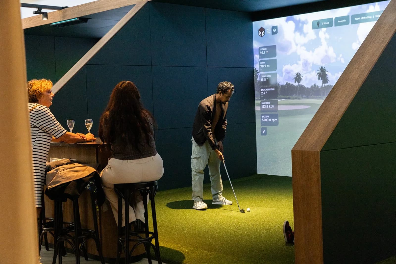 Friends playing indoor golf